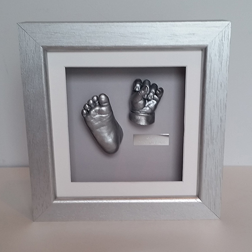 Luxury Hardwood 8x8 Square Silver frame with White front mount, Grey back mount and silver casts of a 6 month old baby