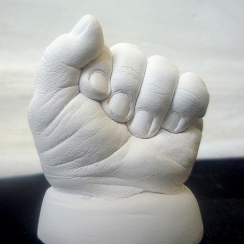 White hand cast of a 6 month old
