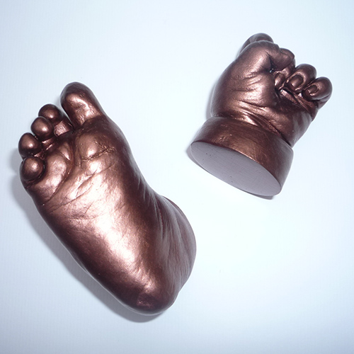 Bronze casts of a 4 month old