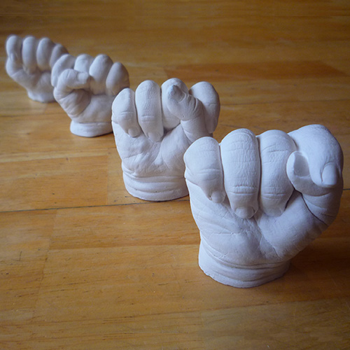 4 white hand casts