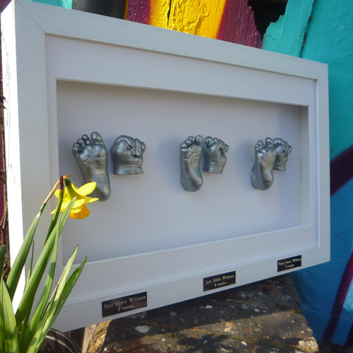 Classic 16x10 White frame with silver casts of 6 week old triplets