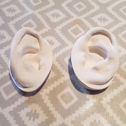Commissioned ear casts for Jessica De Lotz earring display cabinet