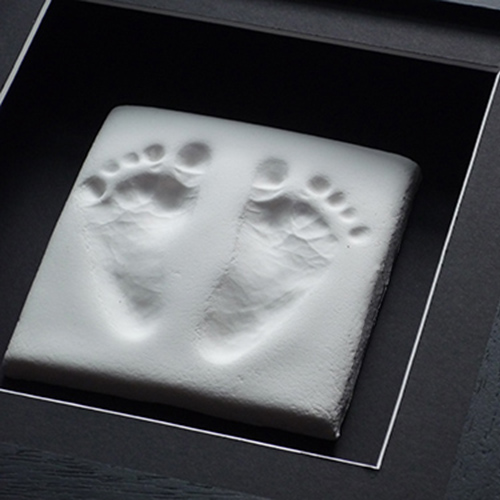 Clay footprints in a Classic 8x8 square frame