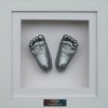 2 Foot Casts in a Square Frame