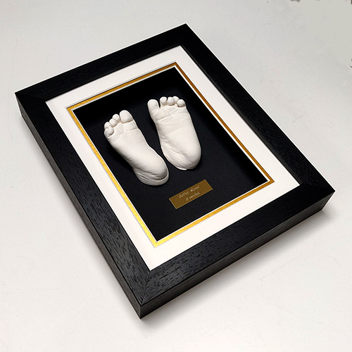 Classic 10x8 Single frame with gold undermount and white casts of a 6 month old.